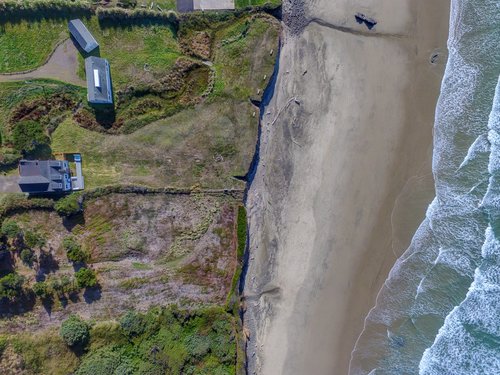 Ocean front property with a large yard.