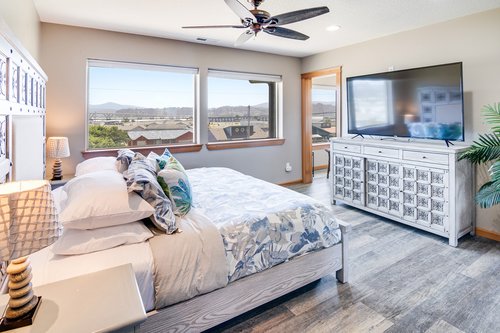 Kick back in bed and watch a movie on the large flat screen tv.
