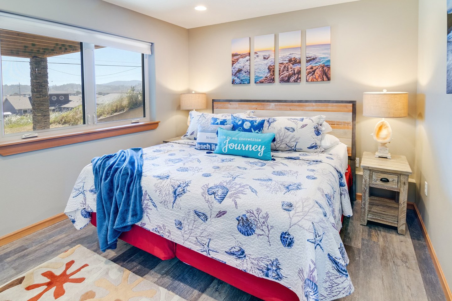 An east-facing bedroom with a king bed on the lower level lets in a lot of morning light.