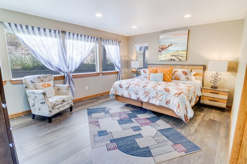 This large bedroom with king bed  is on the entry level floor of this home.