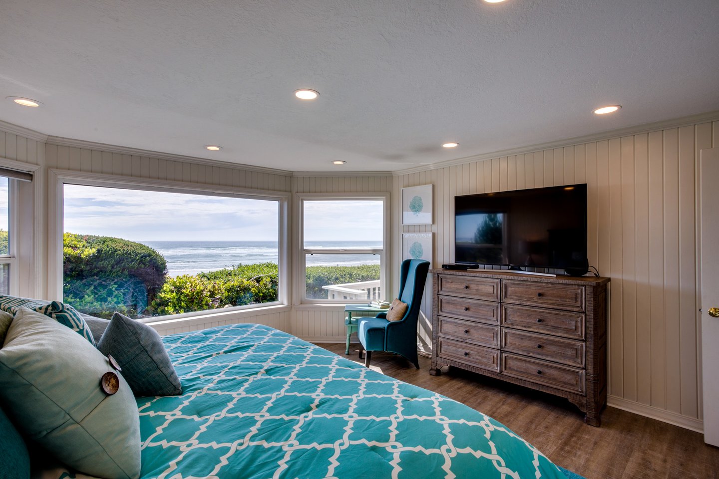 The primary bedroom has a king bed and views of the ocean!