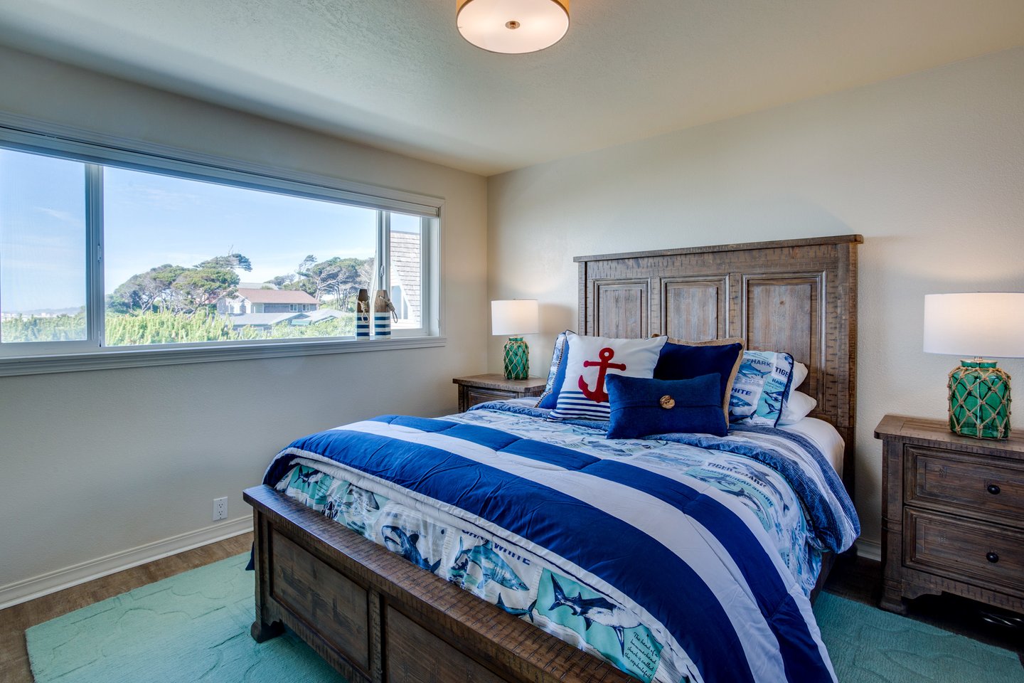 This bedroom has a queen bed with ocean views to enjoy some private time!