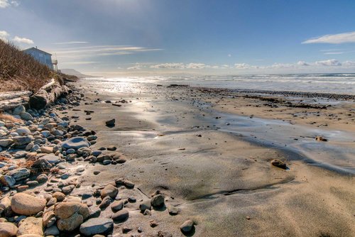 Miles of sandy beach to walk both north and south. Winter time brings out some additional rocks!