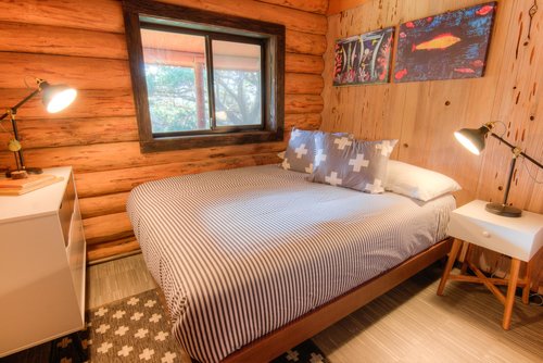 Cozy up in this bedroom with a queen bed.