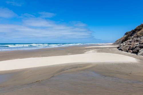 Sandy beach to the north.