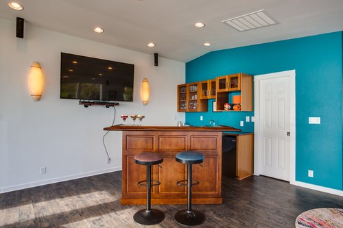 Make your favorite cocktail at the bar and watch a game on the television.