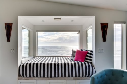 Feel like you are floating on air as you relax on the daybed in the primary bedroom.