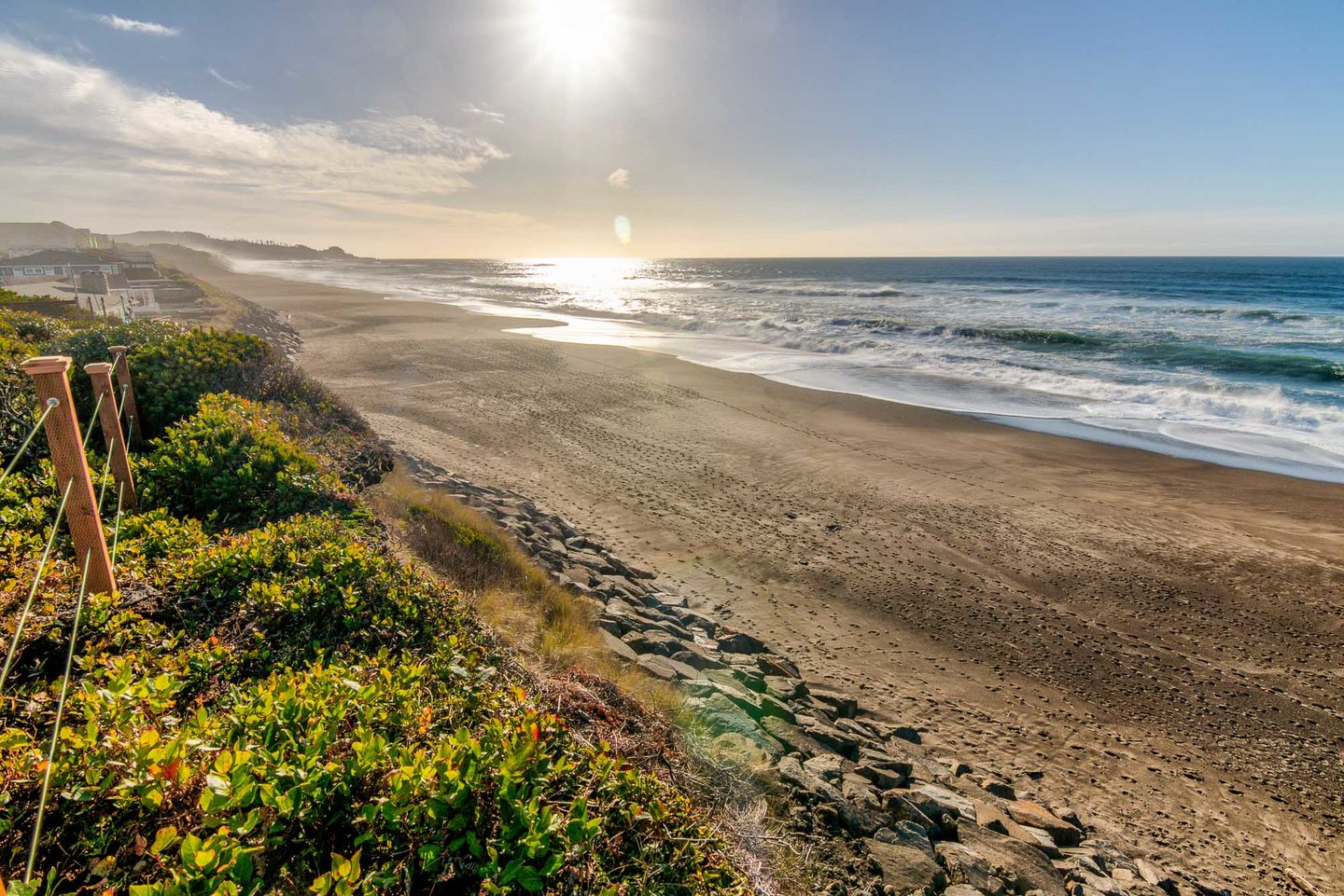 Beach to the south, with rock formations.