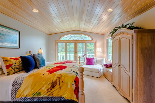 Second upstairs bedroom with an east facing balcony.