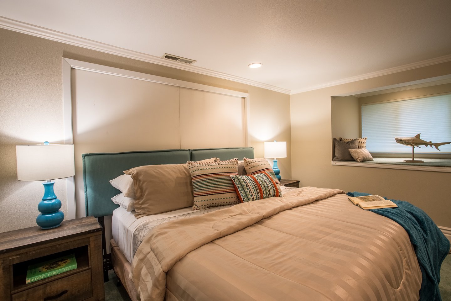 Fourth bedroom downstairs with a window nook.