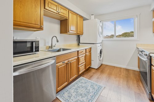Stack washer/dryer in the kitchen.