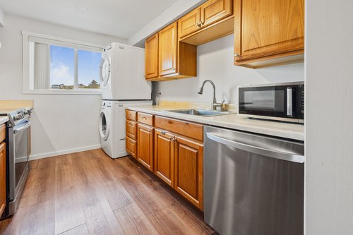 Stack washer/dryer in the kitchen.