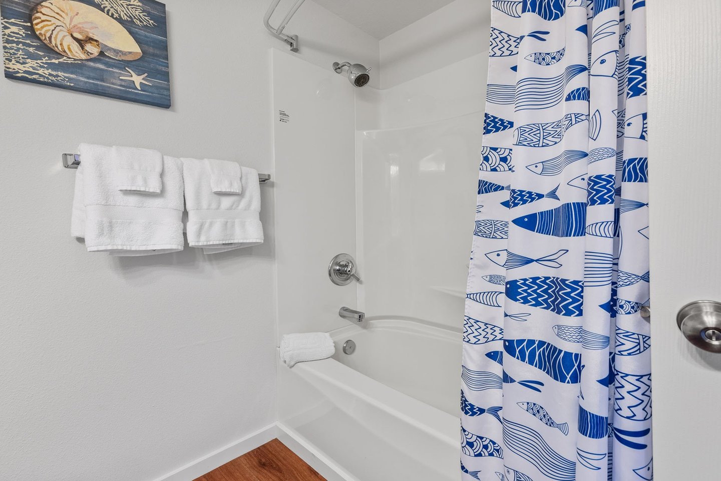 Combo tub/shower in the bathroom.
