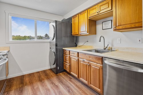 Stack washer/dryer in the kitchen.