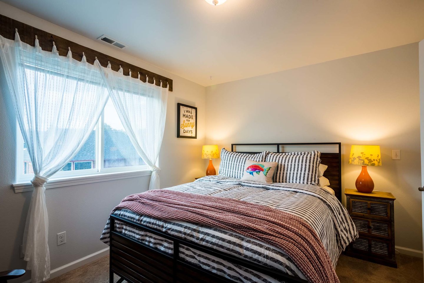 This upper level bedroom has a a comfy queen bed.