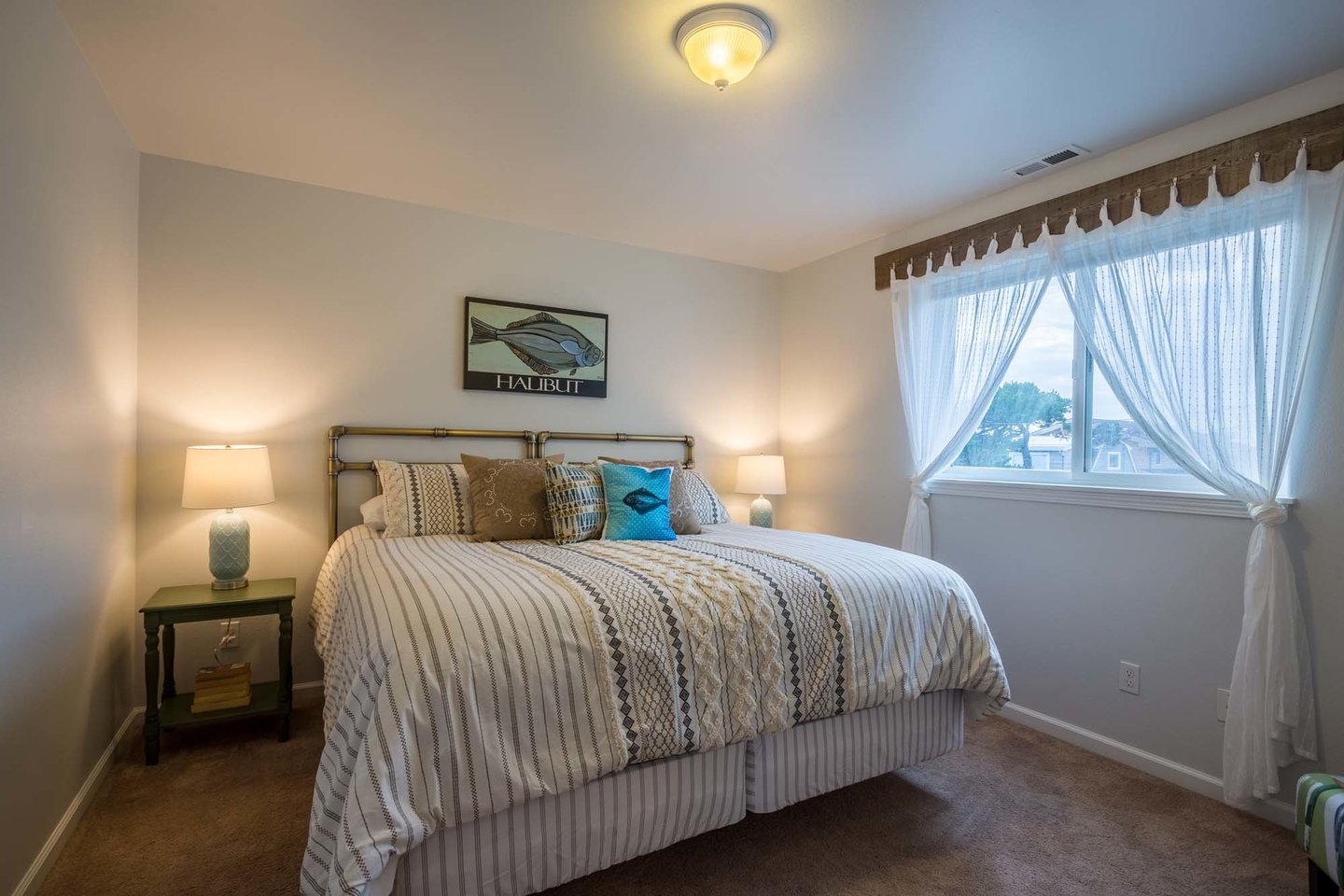 Another upper level bedroom is a perfect getaway with a king bed.