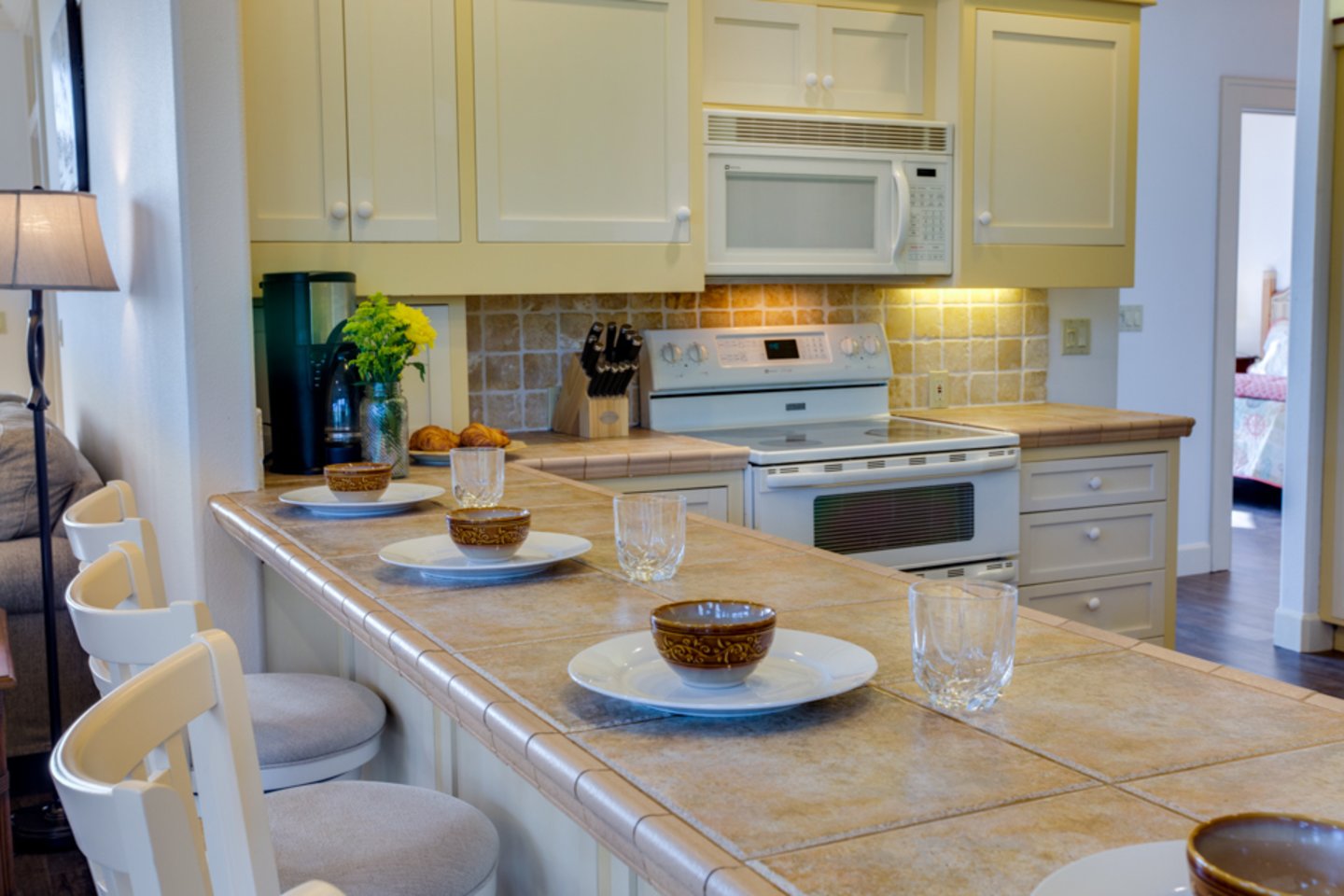 Enjoy together time while sitting at the kitchen breakfast bar.