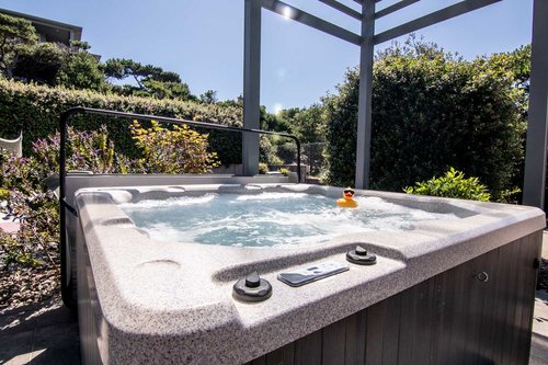Relax in the hot tub after a day of exploring or playing on the sport court.