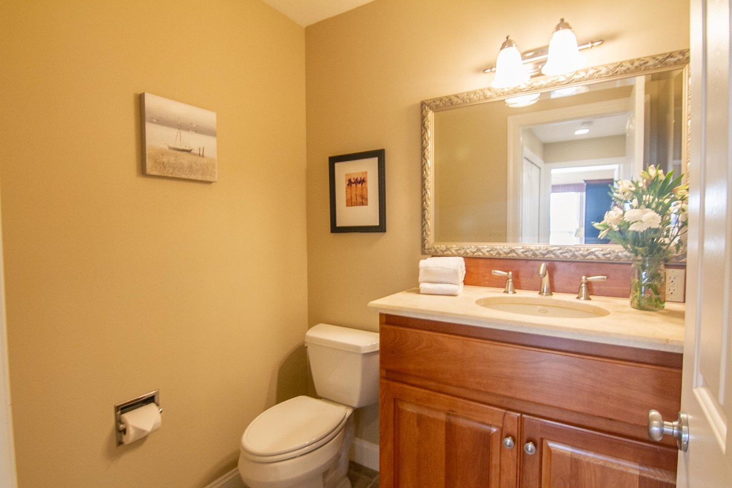 The clean and bright upstairs powder room.
