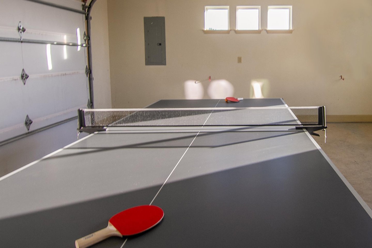 Spend family time in the garage with ping pong and music.