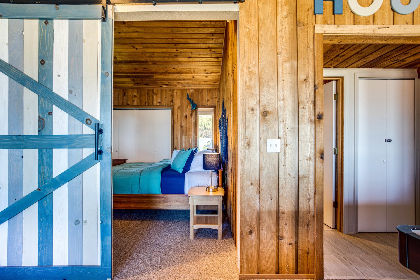 Beautiful barn doors close off both upstairs bedrooms.