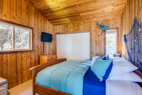 The second bedroom upstairs with a queen bed.