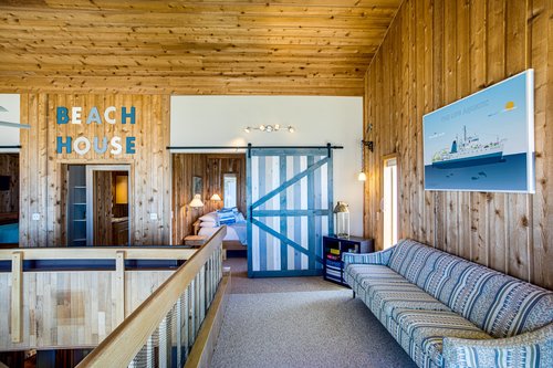 Large barn doors add a pop of color upstairs!