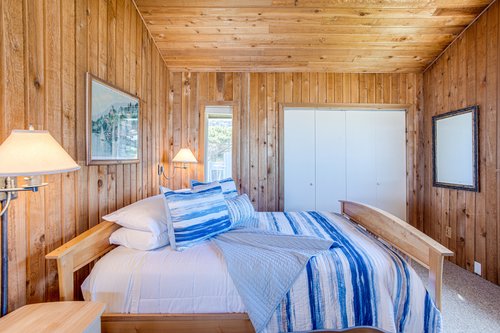 One of the cozy upstairs bedrooms with a queen bed.