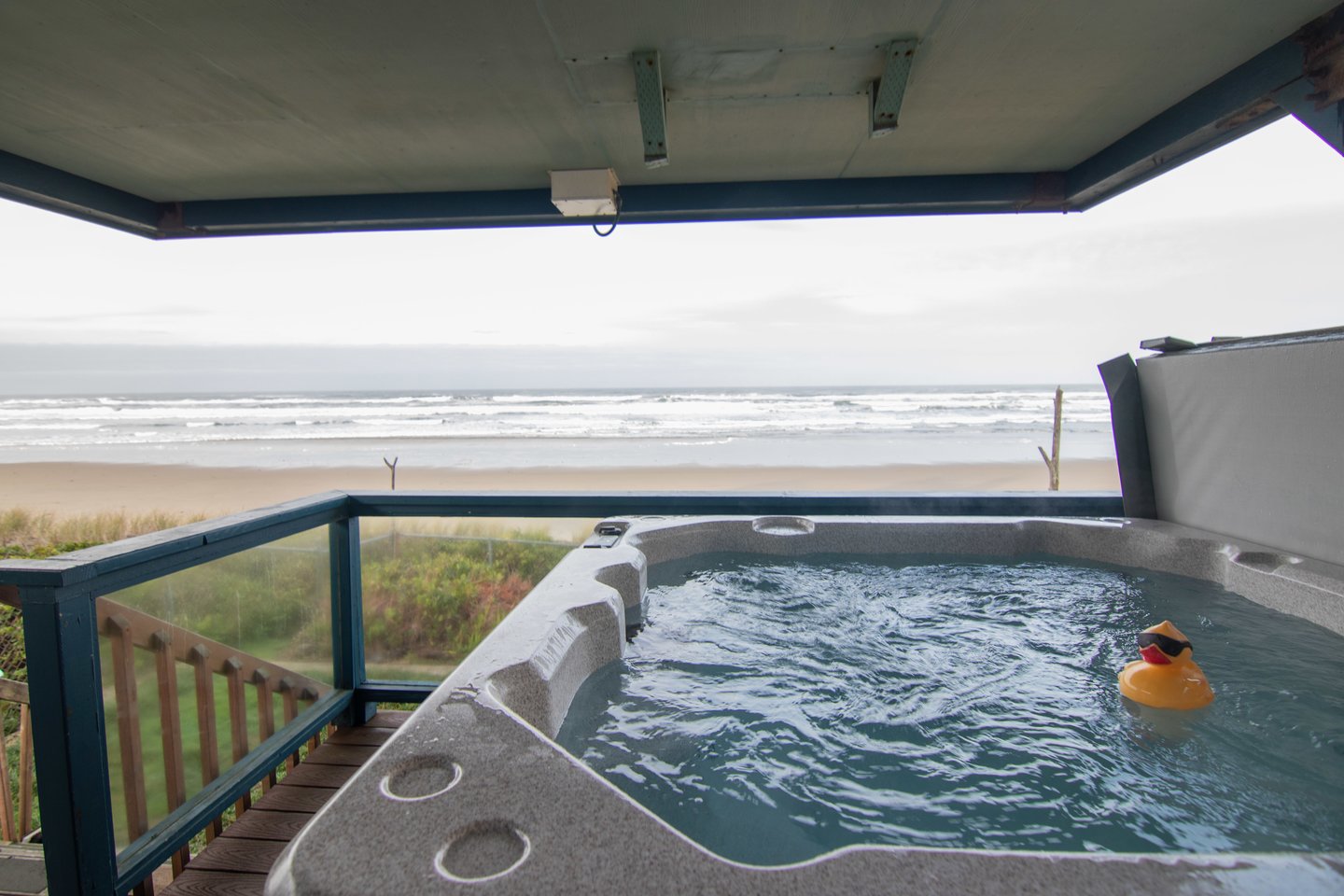 Relax in the hot tub right on the deck with ocean views!