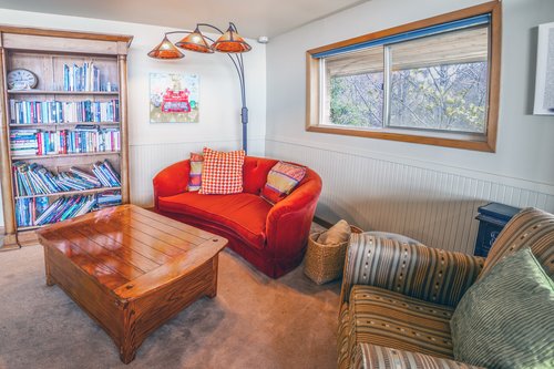 Curl up and read a book in this cozy corner.