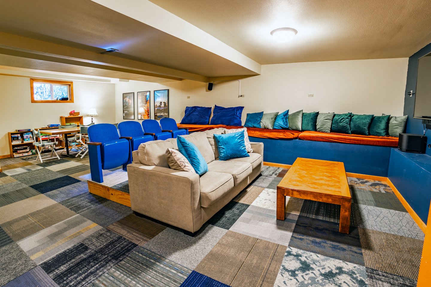 Plenty of space for friends and family in the media/game room.