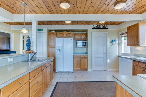 The laundry room is right off the kitchen.