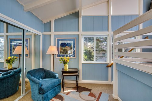 Read a book in the sitting room that is part of the loft bedroom.