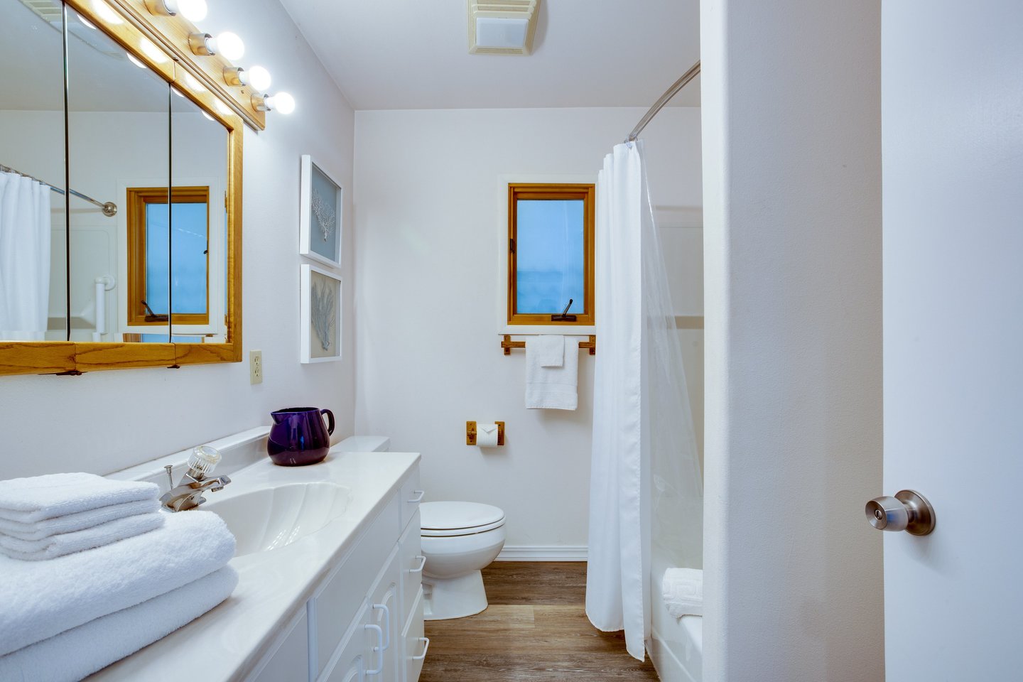 A third bath can be found in the hallway.