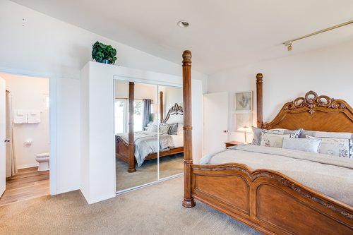 The sun pours into the master bedroom upstairs.