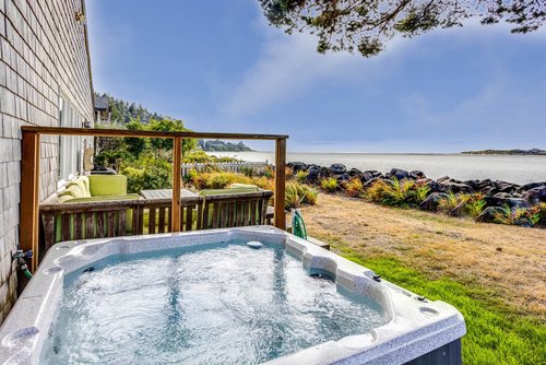 Soak your cares away with a view of the Alsea Bay.