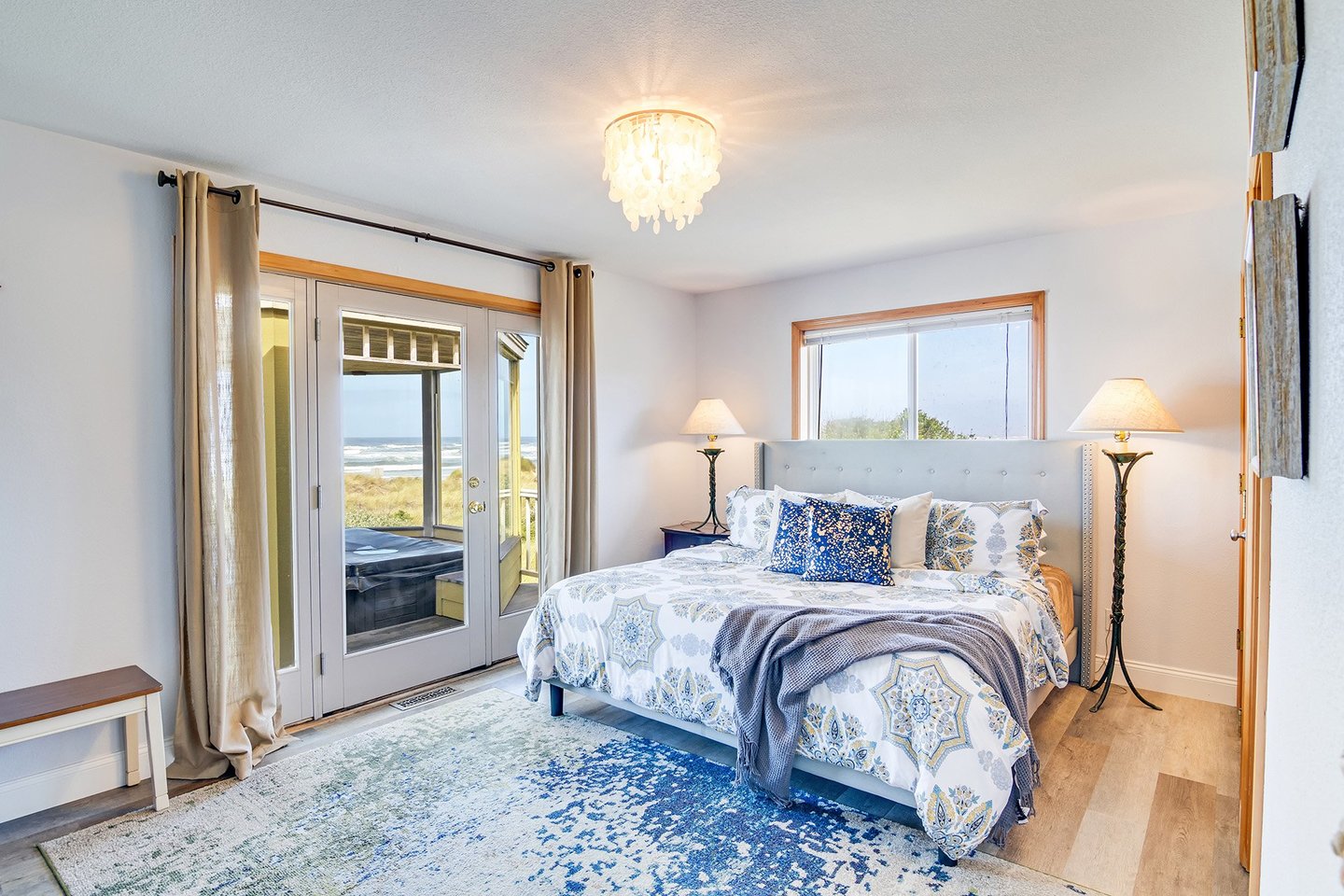 Enjoy the primary bedroom with the hot tub just steps away.