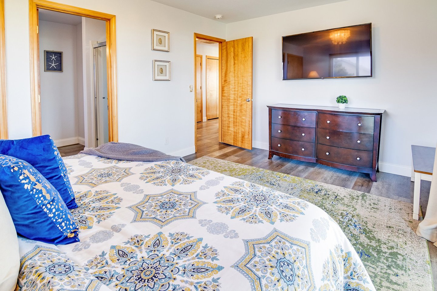 The primary bedroom suite, with its own private bath, is where you can relax and appreciate the ocean views.