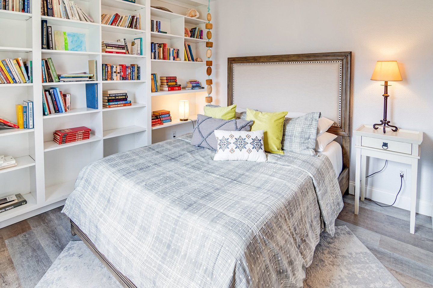 This comfy queen bed provides a relaxing night's sleep.