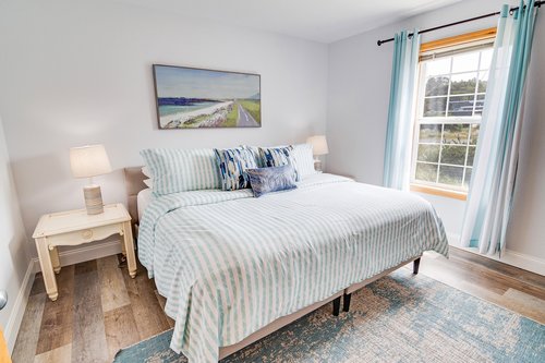 This bright and airy bedroom is the perfect place to unwind.