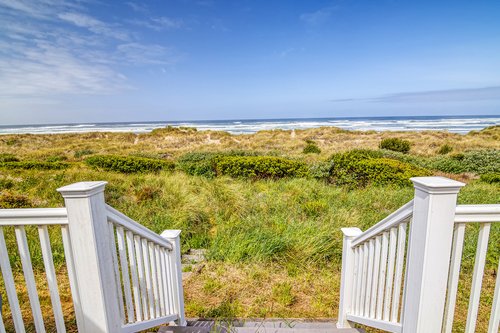 Enjoy private beach access right off of your deck.