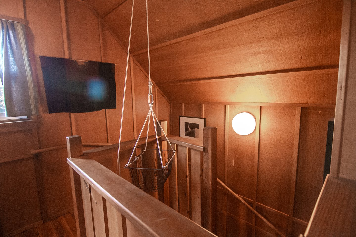 A basket on a pully makes it easy to bring things up the stairs.