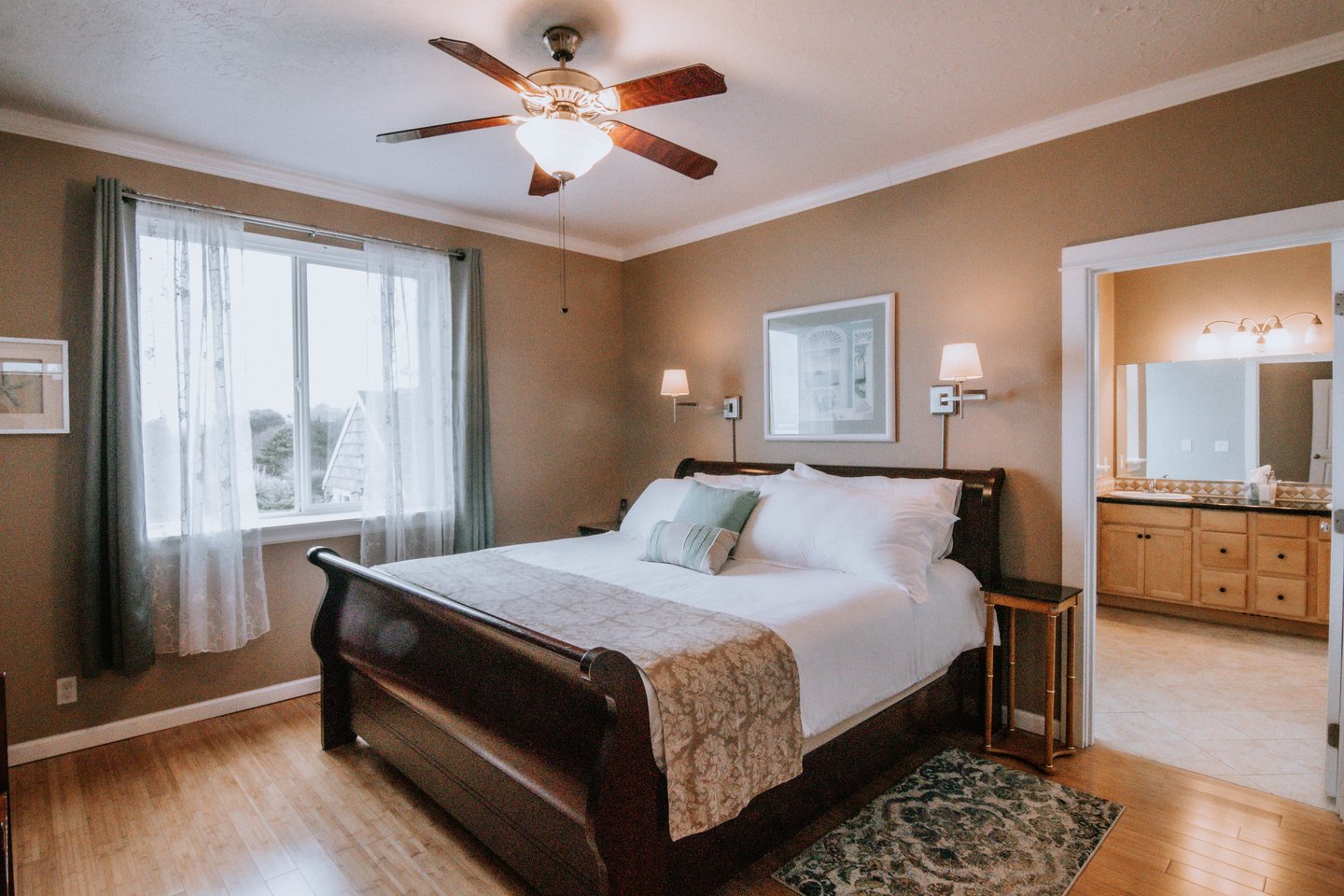 Sleep to the sounds of the ocean in the primary bedroom with ensuite bath.