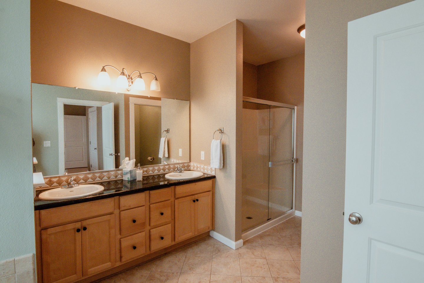 The double vanity and walk in shower is very spacious.