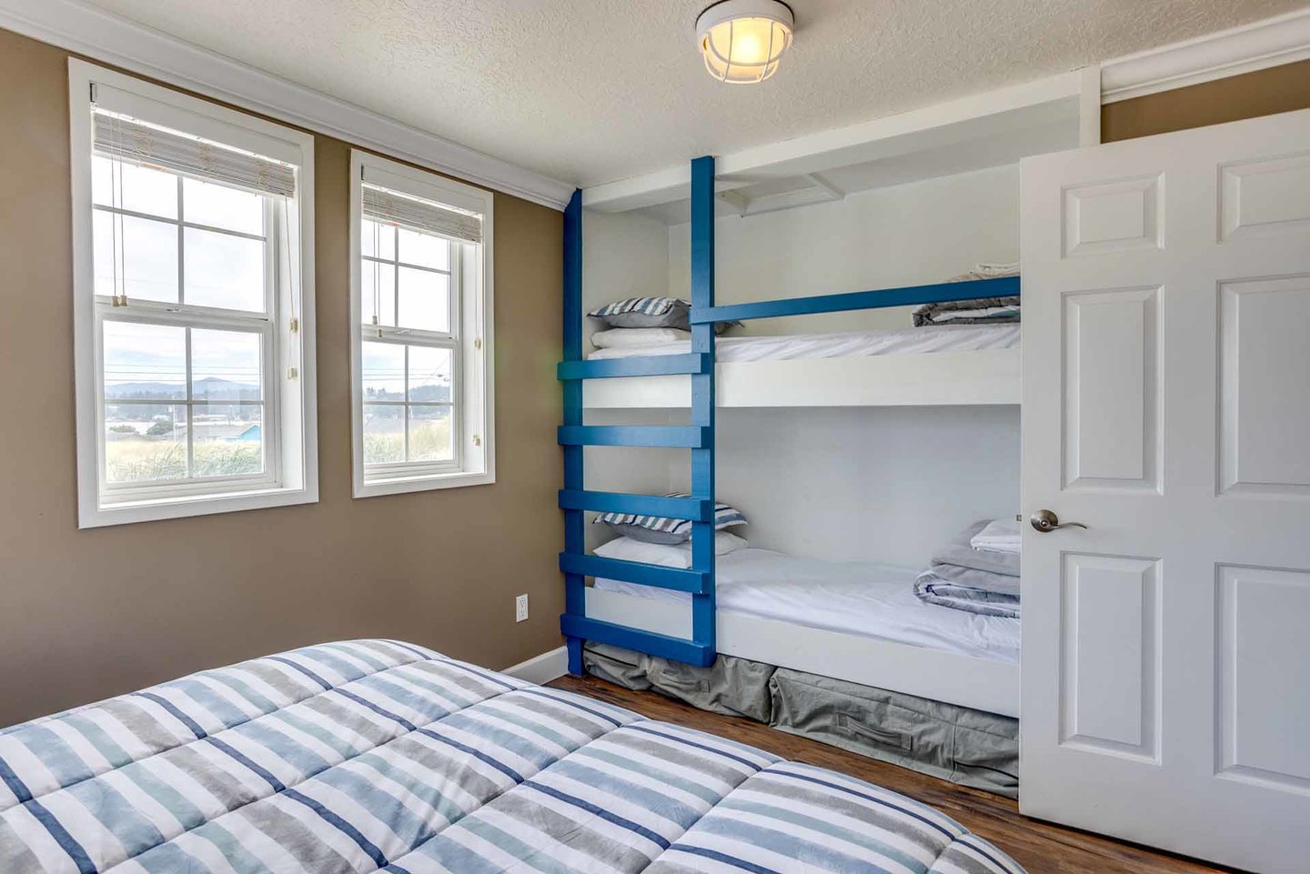 The second bedroom has a comfy queen bed and built in bunk beds.