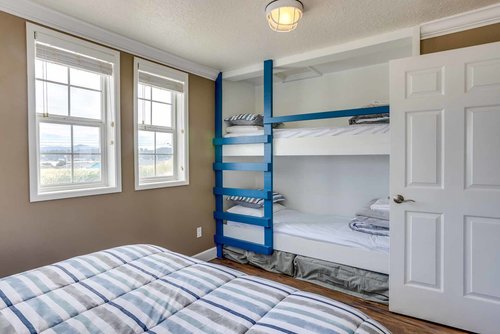 The second bedroom has a comfy queen bed and built in bunk beds.