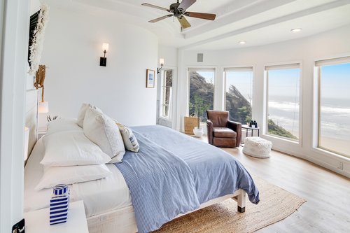 Enter in to the primary bedroom with expansive ocean views.