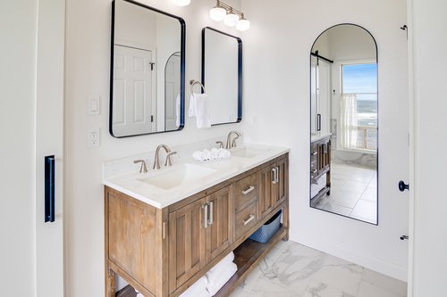The primary bath also has a walk in shower and 2 sinks.