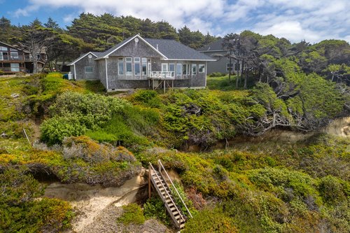 The Coastal Jewel is perfectly located just steps to a pristine sandy beach.
