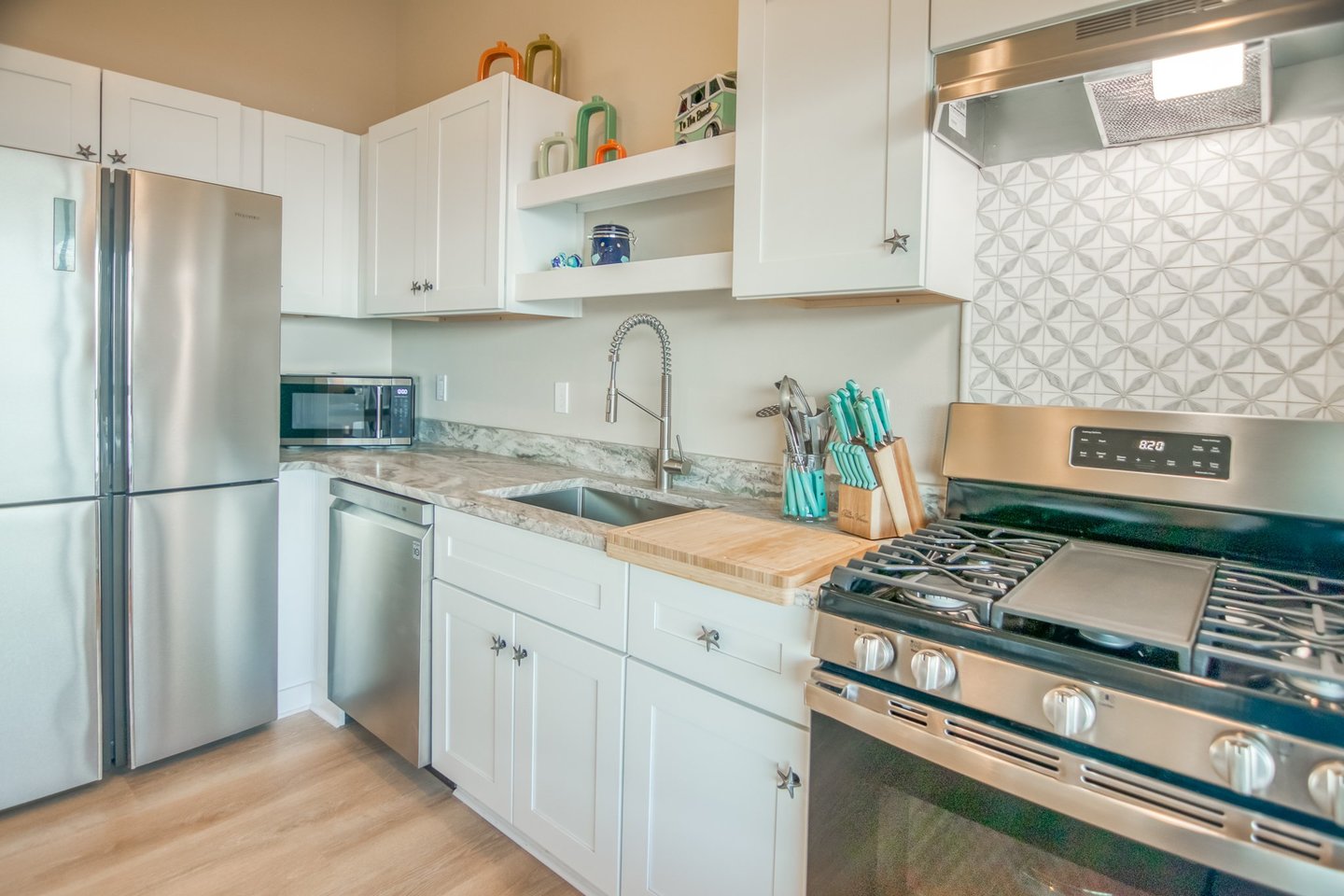 Beautiful stainless steel appliances with gas range.